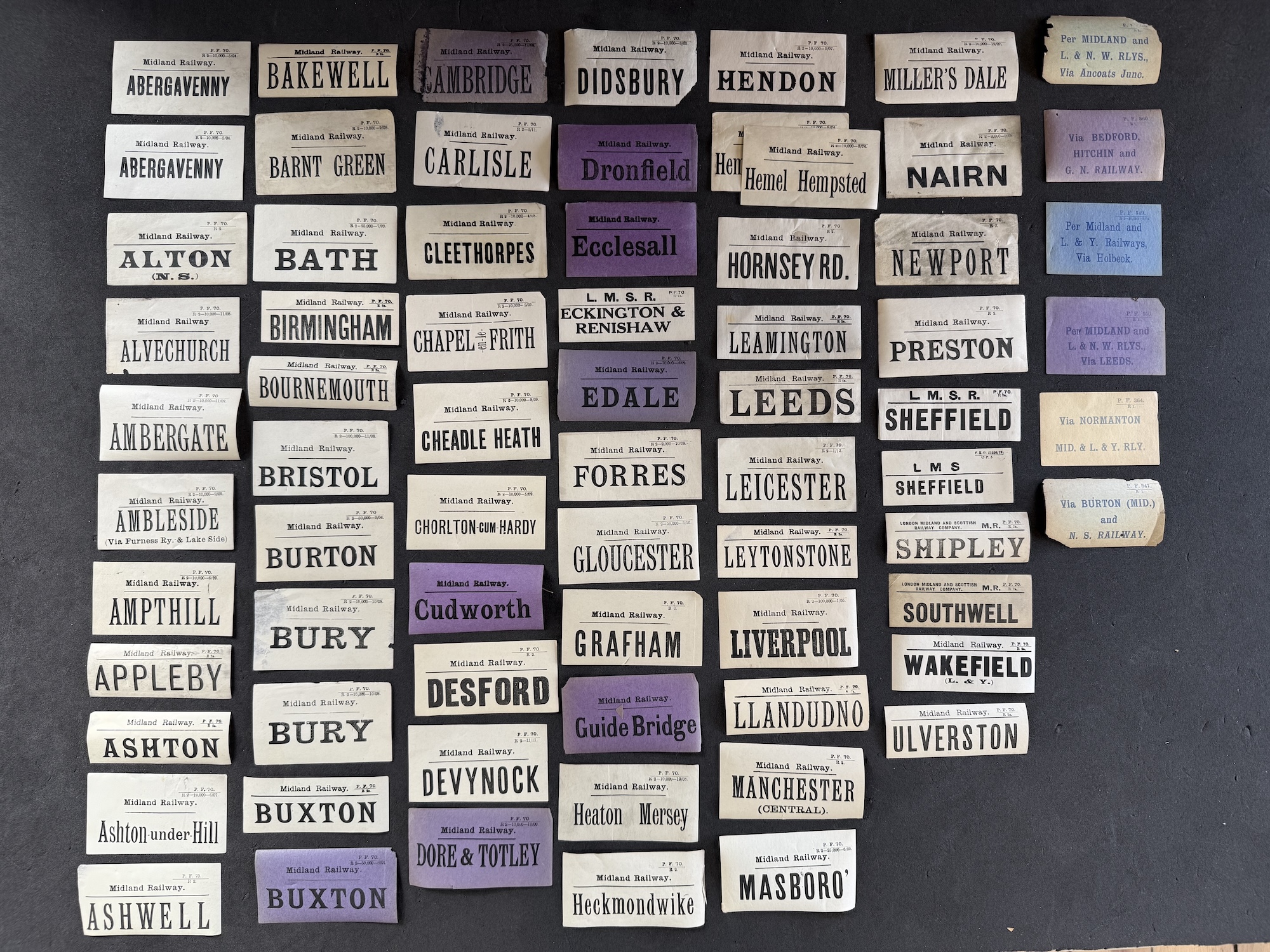 A break-section banner formed ofa Quantity of 72 MR Luggage Labels For Assorted Desitnations...ABERGAVENNY, ALTON (N. S.), ALVECHURCH, AMBERGATE, AMBLESIDE Via Furness Ry. & Lake Side, AMPTHILL, ASHTON, Ashton under Hill, ASHWELL, BAKEWELL, BARNT GREEN, BATH, BIRMINGHAM, BOURNEMOUTH, BRISTOL, BURTON, BURY, BUXTON, BUXTON, CAMBRIDGE, CARLISLE, CLEETHORPES, CHAPEL-EN-LE-FRITH, CHEADLE HEATH, CHORLTON-CUM-HARDY, Cudworth, DESFORD, DEVYNOCK, DORE & TOTLEY, DIDSBURY, Dronfield, Ecclesall, ECKINGTON & RENISHAW, EDALE, FORRES, GLOUCESTER, GRAFHAM, Guide Bridge, Heaton Mersey, Heckmondwike, HENDON, Hemel Hempstead, HORNSEY RD., LEAMINGTON, LEEDS, LEICESTER, LEYTONSTONE, LIVERPOOL, LLANDUDNO, MANCHESTER (CENTRAL), MASBORO', MILLER'S DALE, NAIRN, NEWPORT, PRESTON, SHEFFIELD, SHIPLEY, SOUTHWELL, WAKEFIELD, ULVERSTON.