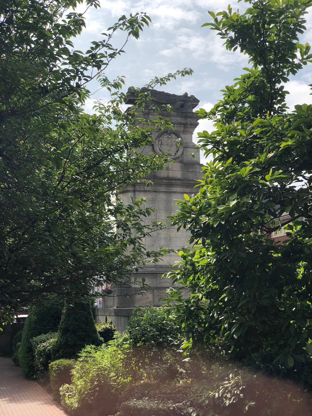 The Midland Railway War Memorial on Midland Road, Derby with poppy wreaths at its base