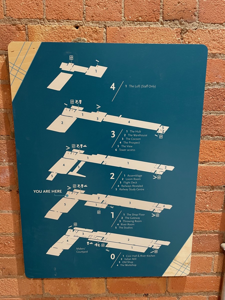 The floor plan of the Museum of Making fixed to a brick wall