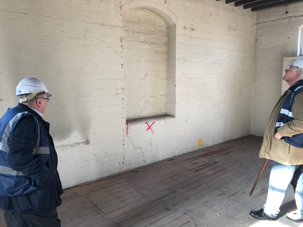  Steve Huson and David Geldard examining the future main entrance to the Midland Railway Study Centre inside the Silk Mill during the refurbishment in 2019