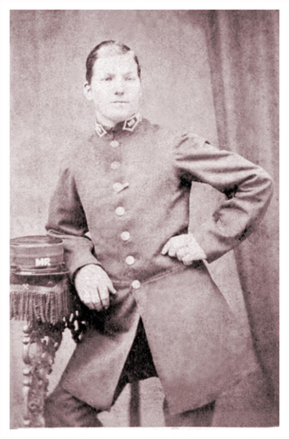 Signalman James Hopcraft of Ilkeston in his Midland Railway uniform pictured in a photographer's studio portrait